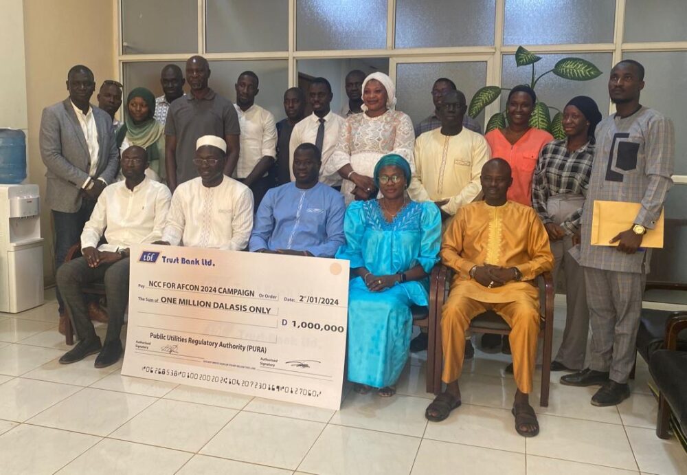 PURA Presents D1 Million Cheque NCC For AFCON 2024 Campaign Gambia Com   Img 8268 1 PnsECJ Scaled 